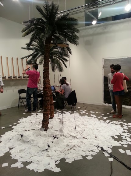 This palm tree spitting out real-time Google search results for "United States" and "Cuba," and "United States" and Puerto Rico" is called Isla. By Peruvian artist Jose Carlos Martinat