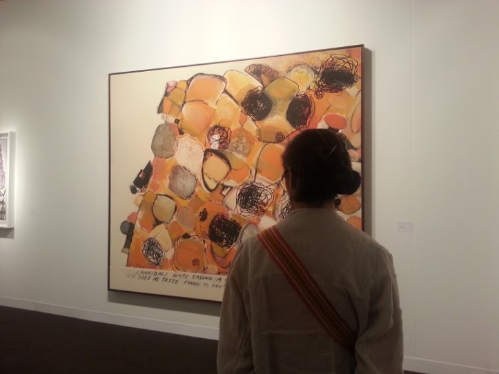 Here's the written caption in this painting by Richard Prince, titled All You Can Eat: "Two cannibals were eating a clown when one said to the other Hey, does he taste funny to you?"