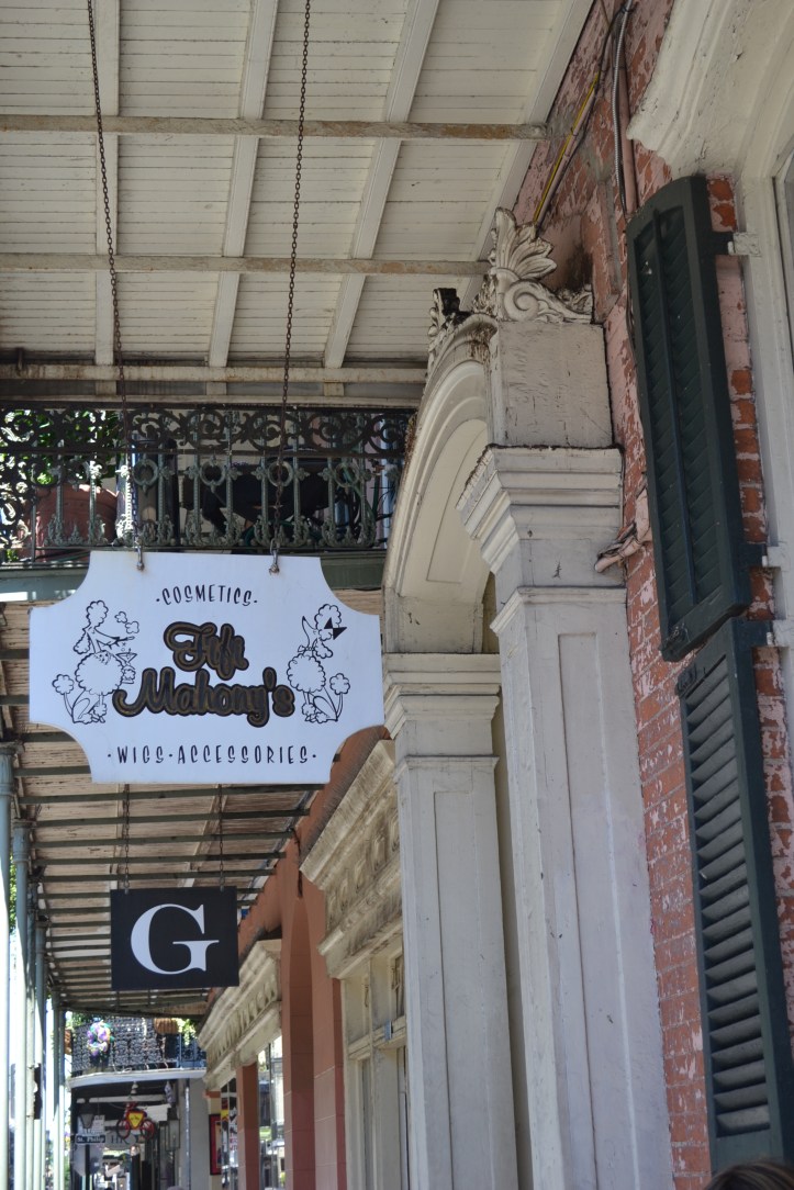 I love all the little shops with eye-catching signs next to shuttered windows.