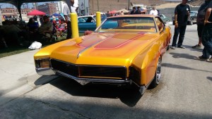 slow & low chicago lowrider community festival pilsen chicago urban art society cuas custom orange and pink california paint job